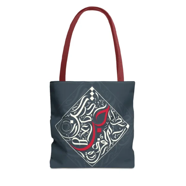 Flat lay product view of the Bedouin Love canvas tote bag featuring modern black Arabic calligraphy art on a clean background by BinMahmood.