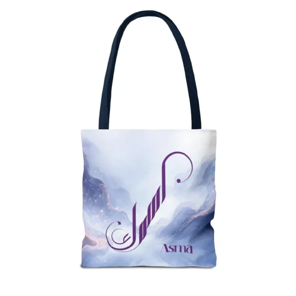 Asma name in BinMahmood original Arabic fusion calligraphy in plum purple ink on a white polyester tote bag with navy handles, marble cloud background — mouse-crafted by BinMahmood