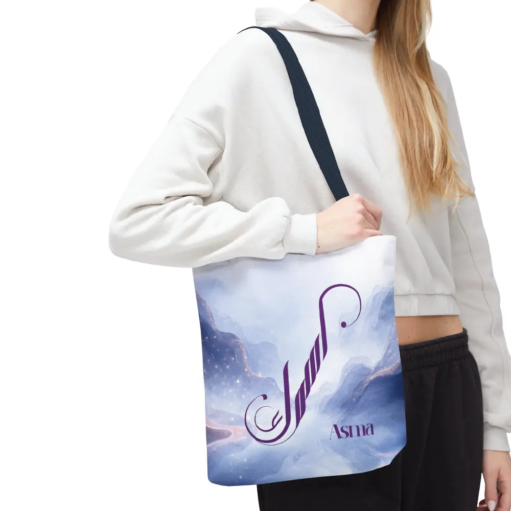 Asma name in BinMahmood original Arabic fusion calligraphy in plum purple ink on a white polyester tote bag with navy handles, marble cloud background — mouse-crafted by BinMahmood