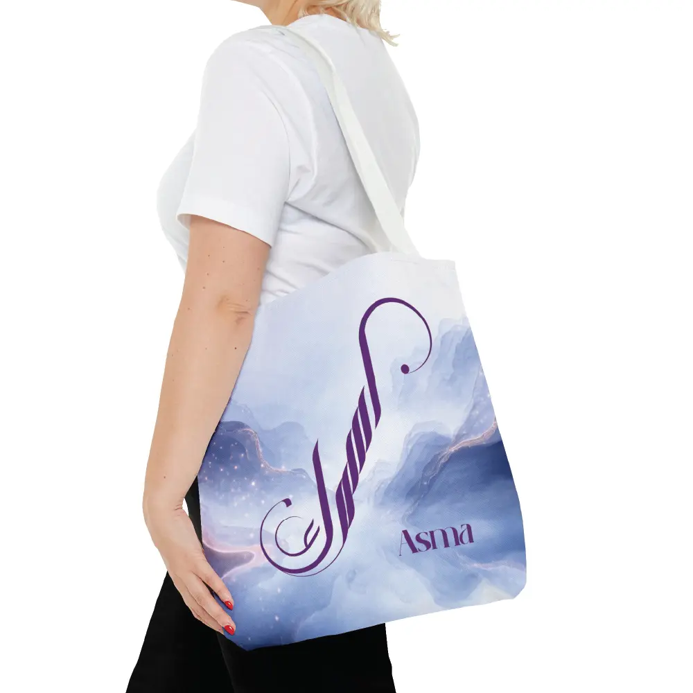 Asma name in BinMahmood original Arabic fusion calligraphy in plum purple ink on a white polyester tote bag with white handles, marble cloud background — mouse-crafted by BinMahmood