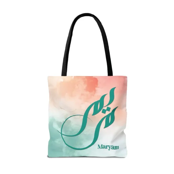 Maryam name in BinMahmood original Arabic fusion calligraphy in teal ink on a polyester tote bag with black handles, soft coral and mint watercolour background, white product view — mouse-crafted by BinMahmood