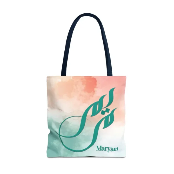 Maryam name in BinMahmood original Arabic fusion calligraphy in teal ink on a polyester tote bag with navy handles, soft coral and mint watercolour background, white product view — mouse-crafted by BinMahmood