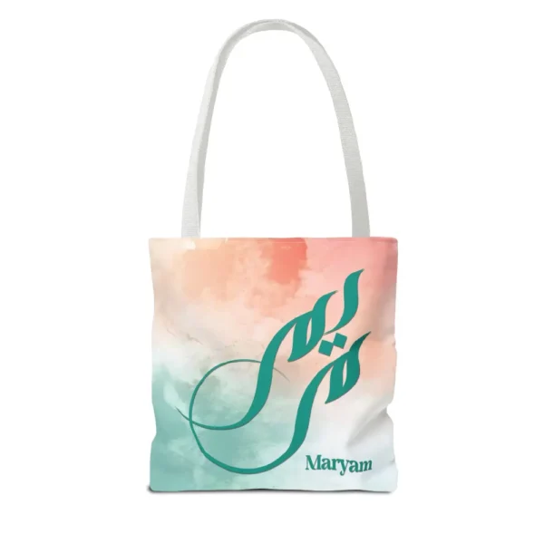 Maryam name in BinMahmood original Arabic fusion calligraphy in teal ink on a polyester tote bag with white handles, soft coral and mint watercolour background, white product view — mouse-crafted by BinMahmood
