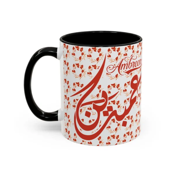 Isolated studio product shot of the Ambreen unique two tone ceramic coffee cup showing a vibrant black rim and accent handle over a solid white background by BinMahmood.