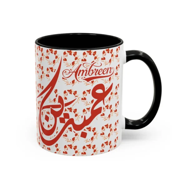 Isolated studio product shot of the Ambreen unique two tone ceramic coffee cup showing a vibrant black rim and accent handle over a solid white background by BinMahmood.