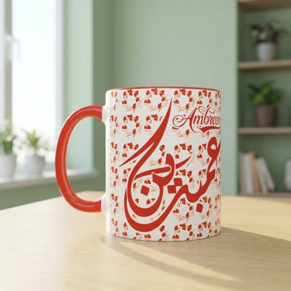 A premium lifestyle view of the Ambreen bespoke Arabic name two tone mug sitting on a light oak wooden table in a brightly lit modern study room by BinMahmood.
