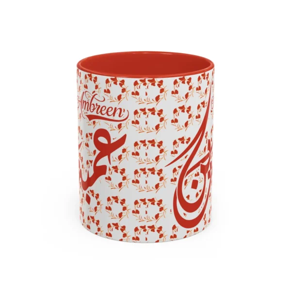 Isolated studio product shot of the Ambreen unique two tone ceramic coffee cup showing a vibrant red rim and accent handle over a solid white background by BinMahmood.