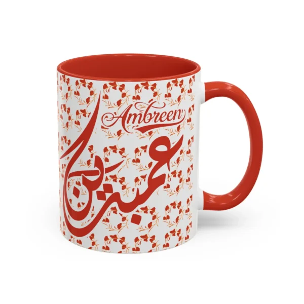 Isolated studio product shot of the Ambreen unique two tone ceramic coffee cup showing a vibrant red rim and accent handle over a solid white background by BinMahmood.