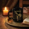 Product photoshoot of Fatimah personalized Arabic name calligraphy black mug with gold matte calligraphy placed on a brass plate with a light candle in the background