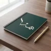 Product photography of Hana name Arabic calligraphy spiral notebook, placed on a warm walnut wood surface - binmahmood