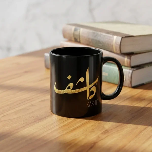 Product Photoshoot of Kashif name Arabic calligraphy black mug with gold calligraphy, placed on a Burma Teak table