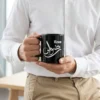 Product photoshoot of a male model holding Rizwan Arabic Fusion Calligraphy Black Mug - BinMahmood
