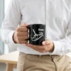 Rizwan personalized black coffee mug with Arabic calligraphy, styled on a wooden desk