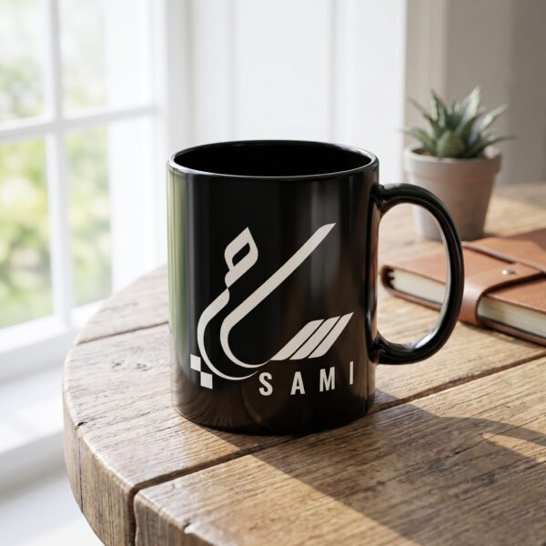 Sami personalized Arabic calligraphy black mug on a wooden table in bright natural light.