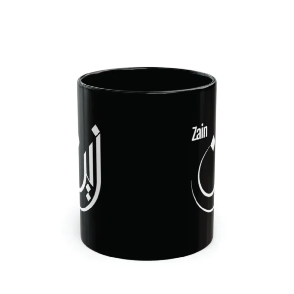 Black mug with white Arabic calligraphy “Zain” on clean white background, personalized name mug by BinMahmood