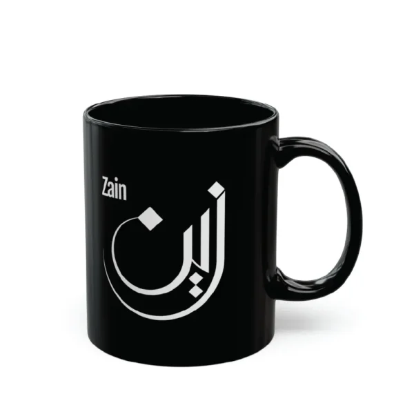 Black mug with white Arabic calligraphy “Zain” on clean white background, personalized name mug by BinMahmood
